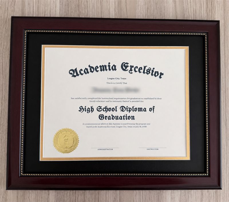 Homeschool diploma in a mahogany frame with black and gold matting and an embossed gold seal